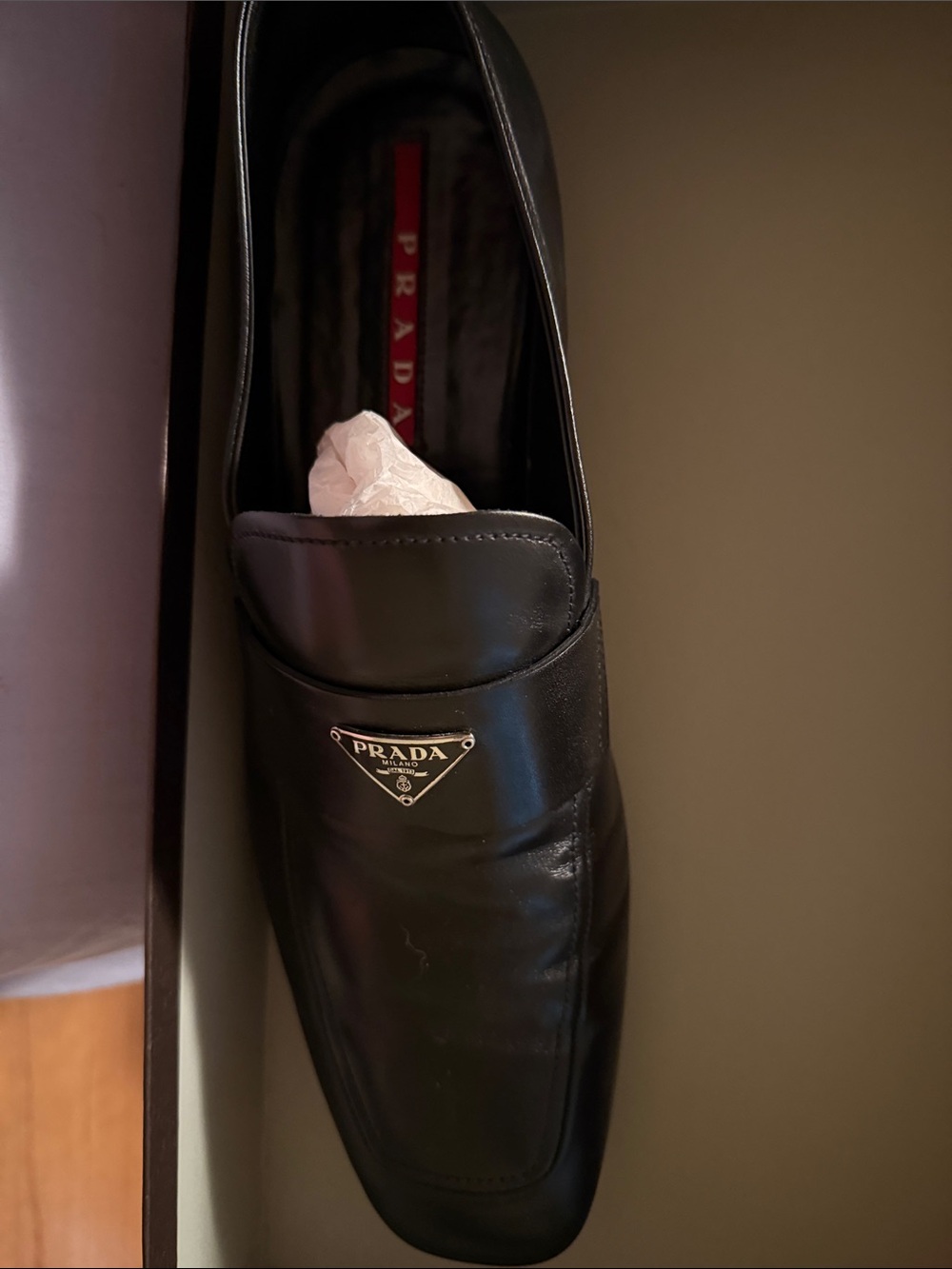 Prada Black Leather Slip-On Loafers with Metal Logo